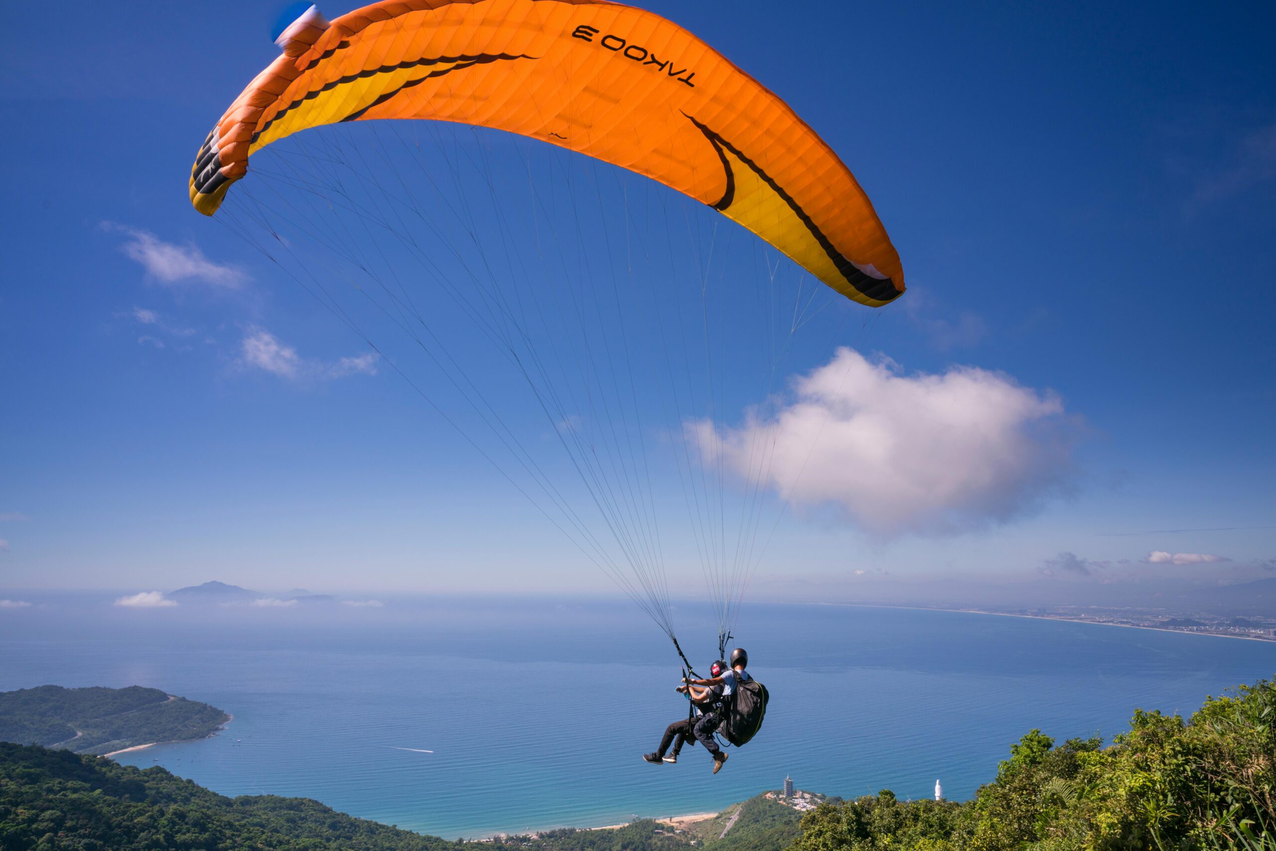 Experience the thrill of paragliding over a stunning ocean view. Perfect for adventure seekers.